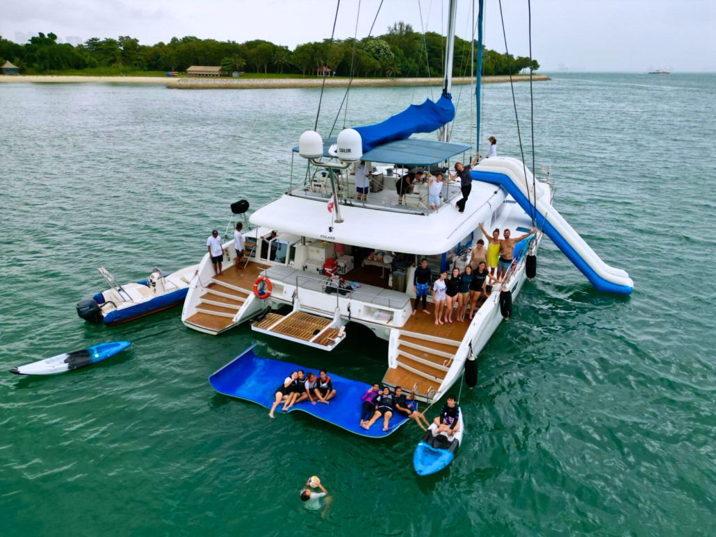 Ping-Lady-with-Slide Ping Lady_62ft catamaran for yacht rental in Singapore.