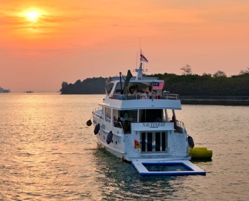 Sunset onboard the Nautiness; A 82ft motor yacht in Singapore