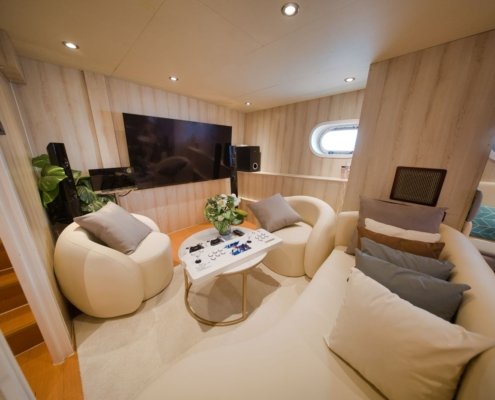 Entertainment lounge onboard Nautiness yacht rental Singapore