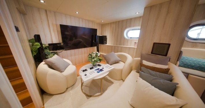 Entertainment lounge onboard Nautiness yacht rental Singapore