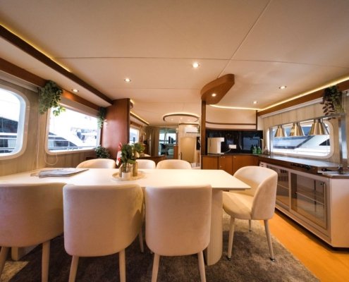 Seated Dining setup onboard Nautiness private yacht charter Singapore