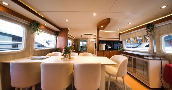 Seated Dining setup onboard Nautiness private yacht charter Singapore